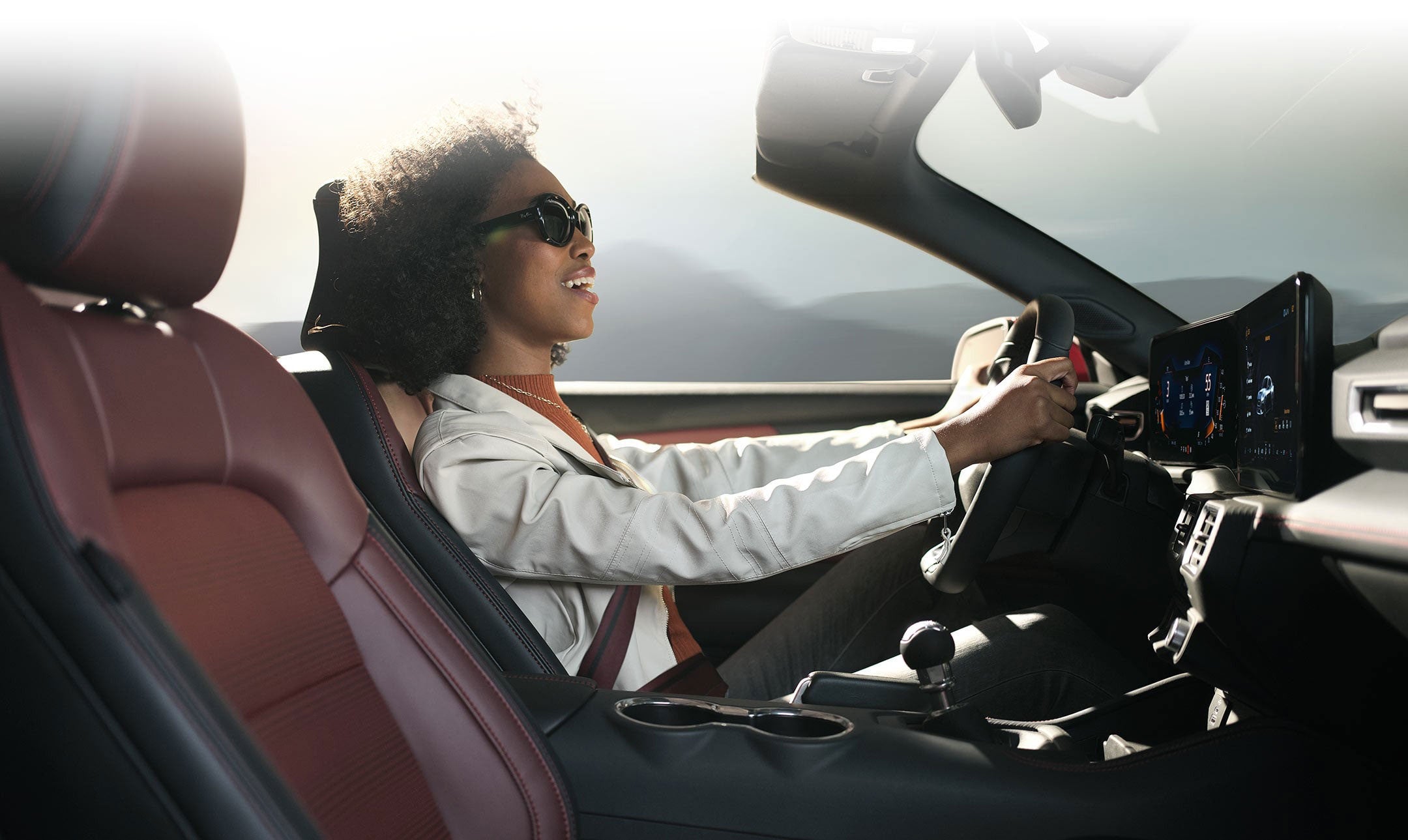 Person sitting in the driver’s seat of a 2024 Ford Mustang® convertible | Casa Ford in El Paso TX