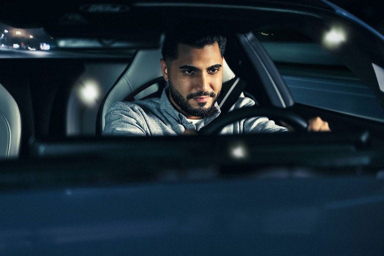 Person sitting in the driver’s seat of a parked 2024 Ford Mustang® coupe | Casa Ford in El Paso TX