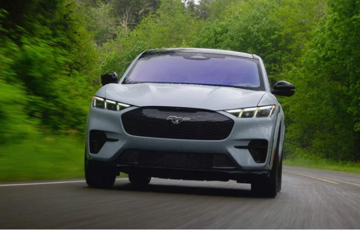Blue Ford SUV driving on the highway