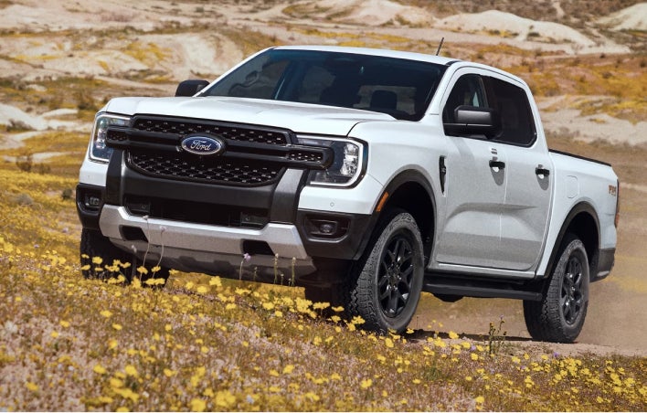 White Ford Truck going up hill
