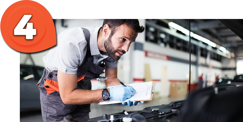 Casa Ford Technician examining a ford vehicle