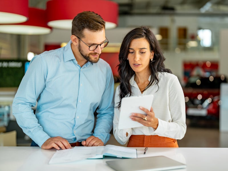 Casa Ford financial advisor assisting a customer
