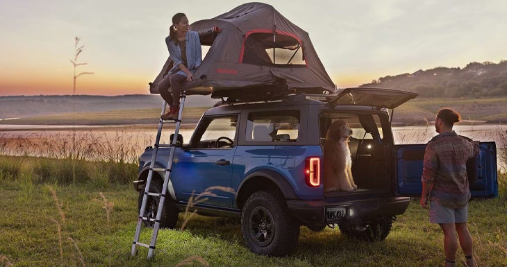 a couple taking a vehicle out for a test drive